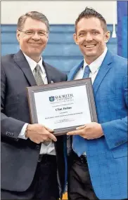  ?? Shorter university ?? Shorter University President Dr. Don Dowless (left) presents the 2021 President’s Award for Excellence in Teaching to Dr. Clint Helms during the school’s 2021 Awards Day.