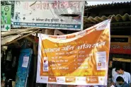  ??  ?? Posters promoting the cashless village campaign.