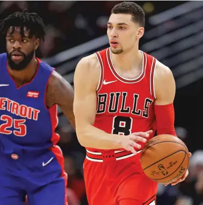  ??  ?? Zach LaVine scored 14 points on 5- for- 9 shooting in 19 minutes in his Bulls debut Saturday against the Pistons. | GETTY IMAGES