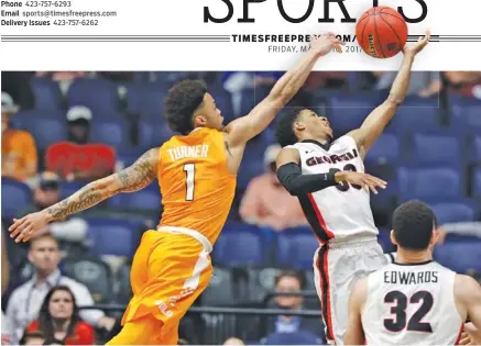  ?? THE ASSOCIATED PRESS ?? Tennessee’s Lamonte Turner and Georgia’s J.J. Frazier battle for a loose ball during their second-round game at the SEC tournament Thursday afternoon in Nashville. Georgia won 59-57 to advance to a quarterfin­al against top-seeded Kentucky today.