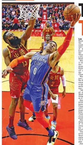  ?? — AP ?? Oklahoma City Thunder guard Russell Westbrook drives to the basket against Houston Rockets guard James Harden during an NBA game.