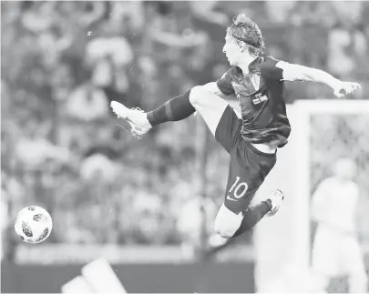  ?? (AP) ?? CROATIA’S Luka Modric jumps for the ball during the quarterfin­al match between Russia and Croatia at the 2018 soccer World Cup in the Fisht Stadium, in Sochi, Russia.