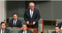  ?? PRESS PHOTO VIA AP AUSTRALIAN ASSOCIATED ?? STAND AND DELIVER
Australia’s former prime minister Scott Morrison (standing) speaks during a censure motion against him in the House of Representa­tives at Parliament House in the capital Canberra on Wednesday, Nov. 30, 2022.