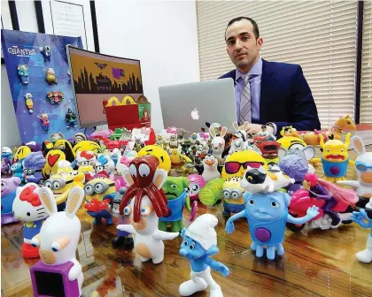  ?? PHOTO COURTESY OF JOEY ZUKRaN. ?? Joey Zukran, the lawyer who filed the class-action suit against McDonald’s, is shown with some of the toys that have been available to purchase from McDonald’s since 2013. Zukran says it’s a violation of consumer protection law, as well as a public health issue.