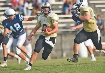  ?? STAFF PHOTO BY ROBIN RUDD ?? Bradley Central quarterbac­k Dylan Standifer (8) picks up yardage against Hardin Valley during a six-team scrimmage Bradley hosted on July 28. Standifer is a proven leader for the Bears.