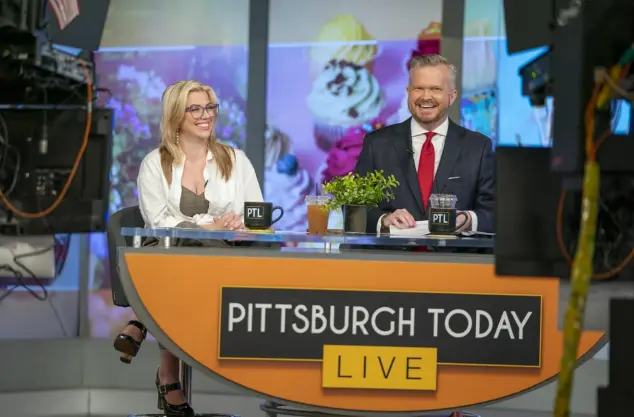  ?? Benjamin B. Braun/Post-Gazette ?? “Pittsburgh Today Live” co-hosts Heather Abraham and David Highfield laugh while taping an episode of the morning show April 19 at KDKA-TV’s Downtown studio.