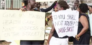  ??  ?? Women in Kampala protest against dress code and anti-pornograph­y legislatio­n. (AFP)