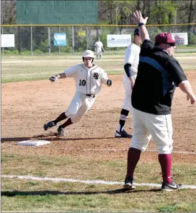  ?? Bud Sullins/Special to the Herald-Leader ?? Siloam Springs baseball coach Alan Hardcastle holds up the stop sign at third base for runner Baron Meek during the Panthers’ game against Greenwood this season. Hardcastle will coach the Siloam Springs American Legion Post 29 team this summer, while...