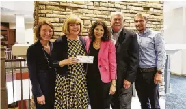  ??  ?? From left are Elena White, GHCF data and impact consultant; Bette Moser, executive director of HomeAid Houston; Renee Wizig-Barrios, GHCF SVP and chief philanthro­py officer; David Weekley, chairman of David Weekley Homes; and Chris Yuko, director of...