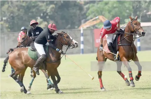  ??  ?? Ibadan polo Captain, Koyinsola Owoeye (left) aims a hook as his opponent from Kano tap past him in one of the matches during the 2019 Ibadan polo tournament.