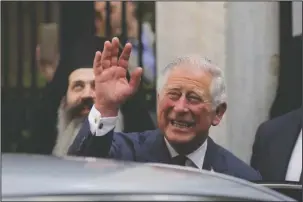  ?? The Associated Press ?? ROYAL WEDDING: Britain's Prince Charles, waved as he left a meeting with the head of Greece's Orthodox Church Archbishop Ieronymos on May 10 in Athens. Kensington Palace announced on Friday that Prince Charles will walk Meghan Markle down the aisle in...