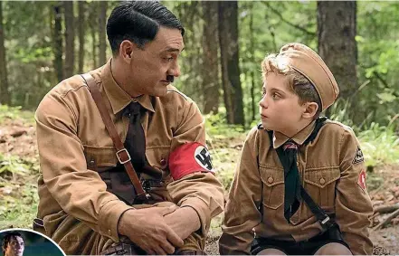  ??  ?? Taika Waititi as Hitler and Roman Griffin Davis as Jojo in Jojo Rabbit.