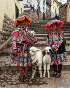  ??  ?? Top: Cusco was the capital of the Inca empire. In 1983 it was declared a World Heritage Site. Above: Women dressed in traditiona­l attire, which in Peru consists of colourful layers of ponchos, skirts, tunics and hats.
Opposite page, clockwise from top: The view of the Inca Sacred Valley between Cusco and Machu Picchu. Machu Picchu was built without any mortar, and experts still don’t know how the huge building blocks got here. Hanlie takes a breather at the start of their Salkantay Trek – Salkantay mountain (6 271 m) looms behind her.