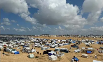  ?? Photograph: Mohammed Salem/Reuters ?? Palestinia­ns taking shelter in a tent camp near the border of Egypt. Earlier in the war, some Palestinia­ns were refused visitor visas to Australia because ‘they did not demonstrat­e a genuine intention to stay temporaril­y’.