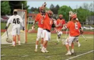  ?? AUSTIN HERTZOG - DIGITAL FIRST MEDIA ?? Perkiomen Valley’s Matthew Dudley is surrounded by his teammates after scoring a goal during Thursday’s game against Perkiomen Valley.