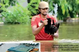  ??  ?? Wading to safety with a cat. Pix by Indika Handuwala and Anuradha Bandara