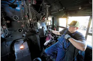  ?? Arkansas Democrat-Gazette/THOMAS METTHE ?? Curt Clark of Cheyenne, Wyo., blows the train whistle Thursday on the Union Pacific Big Boy 4014 steam locomotive during the engine’s stop in North Little Rock.