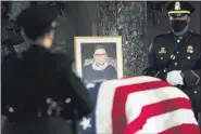  ?? ERIN SCHAFF — THE NEWYORK TIMES VIA AP, POOL ?? The flag-draped casket of Justice Ruth Bader Ginsburg lies in state in the U.S. Capitol on Friday, Sept. 25. Ginsburg died at the age of 87on Sept. 18and is the first women to lie in state at the Capitol.
