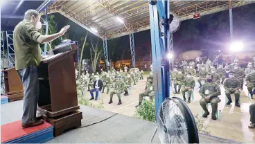  ??  ?? MAKING PEACE — President Duterte talks to military troops at the Edwin Andrews Air Base in Zamboanga City Friday night. The President sought to ease the tension brought about by the death of four Army soldiers in the hands of Philippine National Police (PNP) personnel in Jolo, Sulu last June 29. (Malacanang Photo)