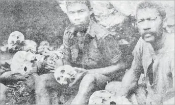  ?? Picture: ANARE RAVULA ?? Manasa Navita (left) and his father Pita Mira show some of the skulls found in a cave on Uluikaukau Mountain by Manasa. The opening of the cave can be seen in the background with more skulls.