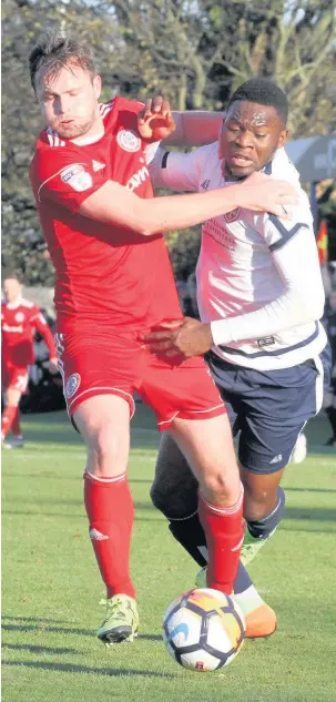  ?? Simon Hall ?? Mark Hughes tussles with Kayode Odejayi