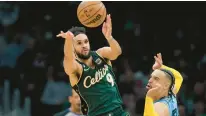  ?? STEVEN SENNE/AP ?? Boston guard Derrick White (9) passes the ball as Memphis forward Dillon Brooks, right, defends in the second half on Sunday.