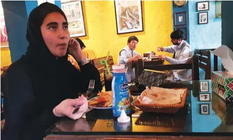  ?? AN photo by Sayed Salahuddin ?? Mahnoosh Amiri at Simple Cafe in uptown Kabul on Saturday. Amiri said she’s worried about the future if the Taliban return to power.