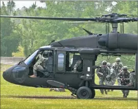  ?? Samuel King Jr.
U.S. Air Force ?? BLACK HAWK HELICOPTER­S, like the one above, were among the aircraft used to fly U.S. troops into Syria to try to capture an Islamic State figure known as Abu Sayyaf. The man, who headed black market operations, was killed.