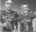  ??  ?? Red Mountain High’s Zach Molina and Shaq Daniels are involved with DreamCatch­ers. ASHLEY TRUSSELL