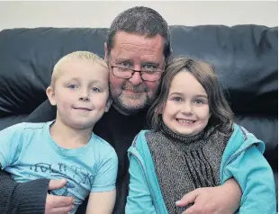  ?? PHOTO: CHRISTINE O’CONNOR ?? Grieving family . . . John Lynch is devastated after the loss of his partner Melissa Coakes. He is pictured with their children Mason and Sophie.