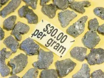  ?? ?? Trinitite, for sale at a rock shop in Bingham, New Mexico, formed when sand, liquefied by the 1945 atomic blast, fell back to Earth.