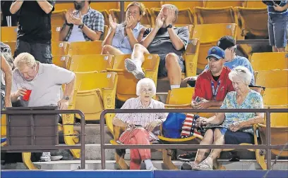  ?? JOSH HOLMBERG/LAS VEGAS REVIEW-JOURNAL ?? Eighty-five-year-old Phyllis Flaherty, center, who has had season tickets to 51s games for 32 years, watches during a game Tuesday between the Las Vegas 51s and El Paso Chihuahuas at Cashman Field.