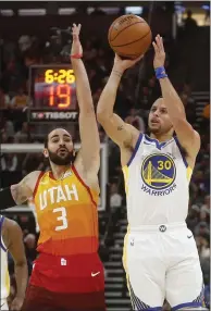  ?? RICK BOWMER — THE ASSOCIATED PRESS ?? Stephen Curry made five 3-pointers on Wednesday, but the Warriors needed one more late to have a chance to beat Utah.