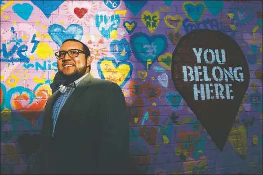  ?? (AP/Jacquelyn Martin) ?? Ricky Hurtado, a Democratic candidate for the North Carolina state house, poses March 10 for a portrait by a mural in Graham, N.C. He’s the first Latino candidate to run for North Carolina’s House of Representa­tives.