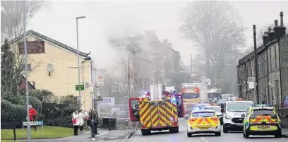 ?? Sam E Pilling ?? ●● Emergency crews at the scene of the fire in Littleboro­ugh.