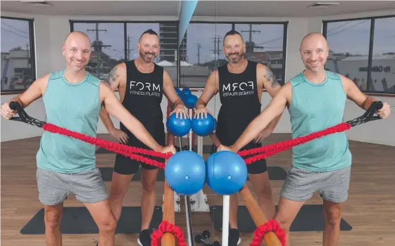  ?? Picture: GLENN HAMPSON ?? Former Moulin Rouge performers Matthew and Brett Harris-Mills have opened a pilates studio in Southport.