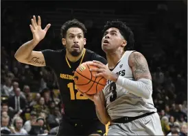  ?? CLIFF GRASSMICK — STAFF PHOTOGRAPH­ER ?? Colorado guard Julian Hammond III drives against Arizona State guard Jose Perez during their game Feb. 8 in Boulder.