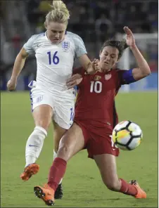  ??  ?? England midfielder Izzy Christians­en (16) attempts a shot as United States midfielder Carli Lloyd defends during the second half of a SheBelieve­s Cup women’s soccer match Wednesday in Orlando, Fla. The United States won 1-0. AP PHOTO/PHELAN M. EBENHACK