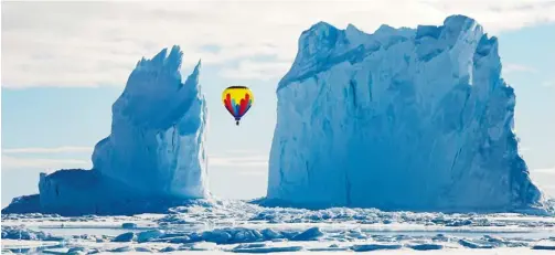  ??  ?? It took 12 days for Michelle Valberg and her crew from Arctic Kingdom to capture this shot. They waited for clear skies, the fog to lift and the 60km/h winds to stop. And then it happened. A gentle western wind, a flash of sunshine and blue, blue skies...