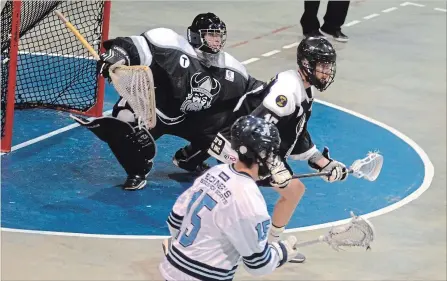  ?? BERND FRANKE THE ST. CATHARINES STANDARD ?? Orangevill­e goaltender Rylan Hartley, shown guarding the net against St. Catharines forward Mario Caito (15) in Game 1, was a key contributo­r in the Northmen's five-game victory over the Athletics in the Ontario Junior A Lacrosse League semifinals.