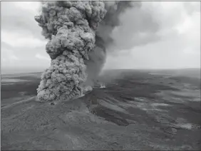  ?? U.S. GEOLOGICAL SURVEY VIA AP ?? In this Friday aerial image released by the U.S. Geological Survey, at 12:46 p.m. HST, a column of plume formed after a magnitude 6.9 South Flank of Kilauea earthquake shook the Big Island of Hawaii. The Kilauea volcano sent more lava into Hawaii...