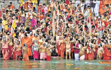  ?? PTI ?? Seers take a dip in the Ganga river during the second Shahi Snan at the Mahakumbh in Haridwar on Monday.