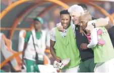  ?? — AFP photo ?? Broos (centre) celebrates with South Africa’s forward Themba Zwane (left) and South Africa’s defender Khuliso Johnson Mudau after winning at the end of the Africa Cup of Nations (CAN) 2024 quarter-final football match between Cape Verde and South Africa.