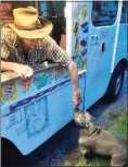  ?? Contribute­d photo ?? Milford’s ice cream guy, Richie Anderson, hands out vanilla ice cream cups to customers’ dogs.