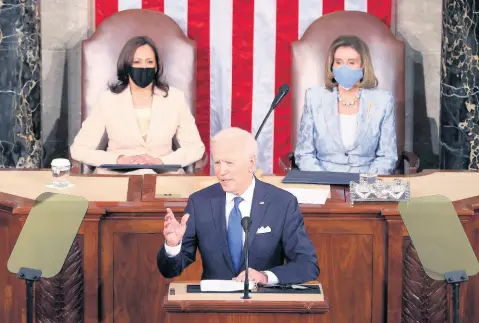  ?? AP ?? President Joe Biden addresses a joint session of Congress, Wednesday, April 28, in the House Chamber at the US Capitol in Washington, as Vice President Kamala Harris(left), and House Speaker Nancy Pelosi look on.