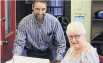  ?? PHOTO: HAMISH MACLEAN ?? History now . . . Waitaki District Archives curator of archives Christophe­r Meech (left) and New Zealand Society of Genealogis­ts Oamaru committee member Beryl Miller peruse the Waitaki County Council 1899 rates register at the archive this week.