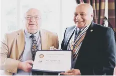  ??  ?? Rotary Club of Sunderland incoming president Derek Sherriff, left, receiving his Paul Harris Fellowship from outging president Sharad Trivedy.