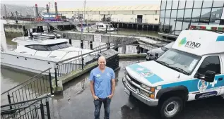  ?? PHOTO: GREGOR RICHARDSON ?? Marine medicine . . . Roving doctor Tom Mulholland stands by his boat at Steamer Basin yesterday.