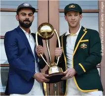  ??  ?? FIERCE RIVALRY: Virat Kohli (left) and Tim Paine with the Border Gavaskar trophy