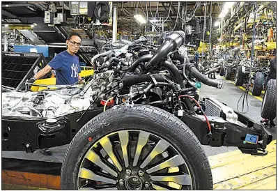  ?? AP file photo ?? Workers assemble Ford trucks in October at a plant in Louisville, Ky. On Thursday, the Institute for Supply Management said its manufactur­ing index rose to 60.8 in February from 59.1 in January.